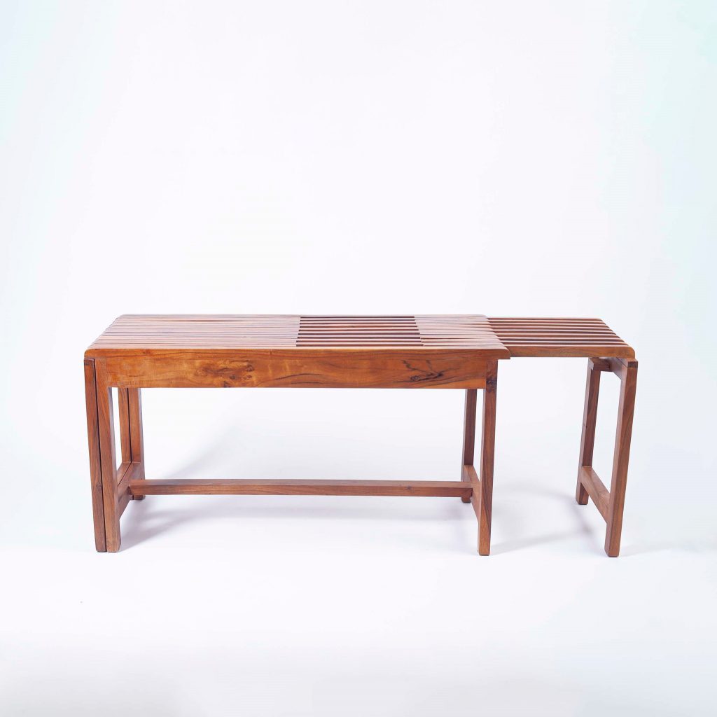 Extendable wooden slat bench in a warm natural finish, designed to lengthen into a larger bench or table, offering a versatile and space-saving solution for small homes.